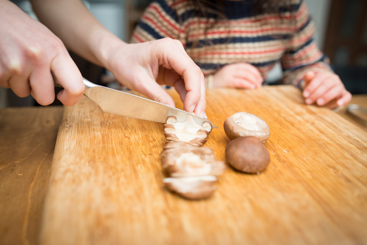 Parent and child cooking vegetables