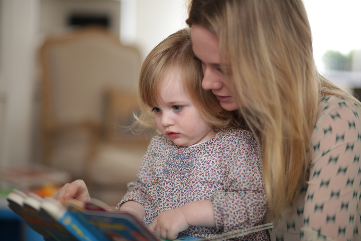 Mother and daughter reading book