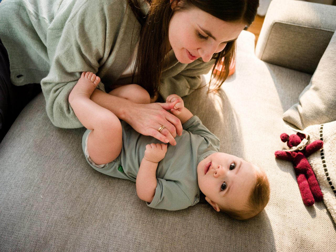 Mom plays with a baby